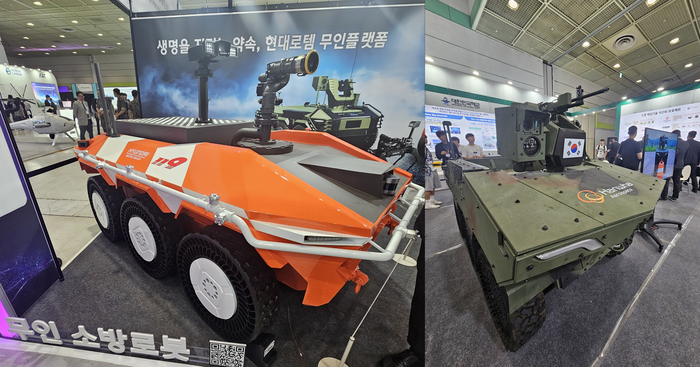 무인 이동체 산업 엑스포 2025 현장 내 현대로템의 HR-셰르파 기반 무인 소방 로봇과 한화에어로스페이스의 아리온 스멧. 사진=박규빈 기자
