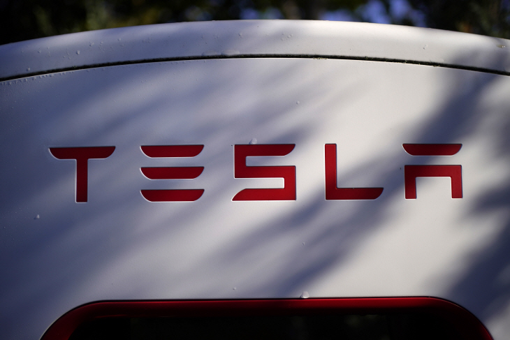 Earns Tesla