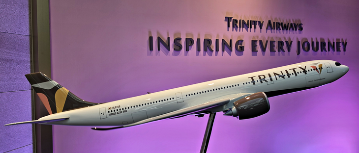트리니티항공이 올 하반기 중 도입할 A330-900neo 여객기 모형과 슬로건. 사진=박규빈 기자